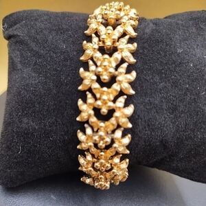 Monet 1960s Gold Tone bracelet with a floral design Elegant Gold Floral Bracelet